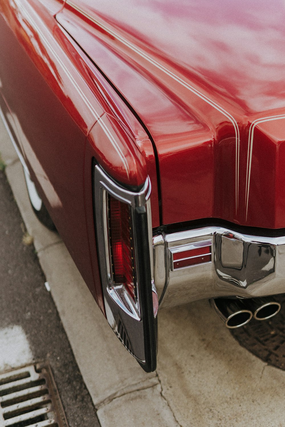 a red car parked on the side of the road