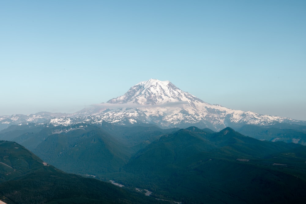 a view of a snow covered mountain in the distance