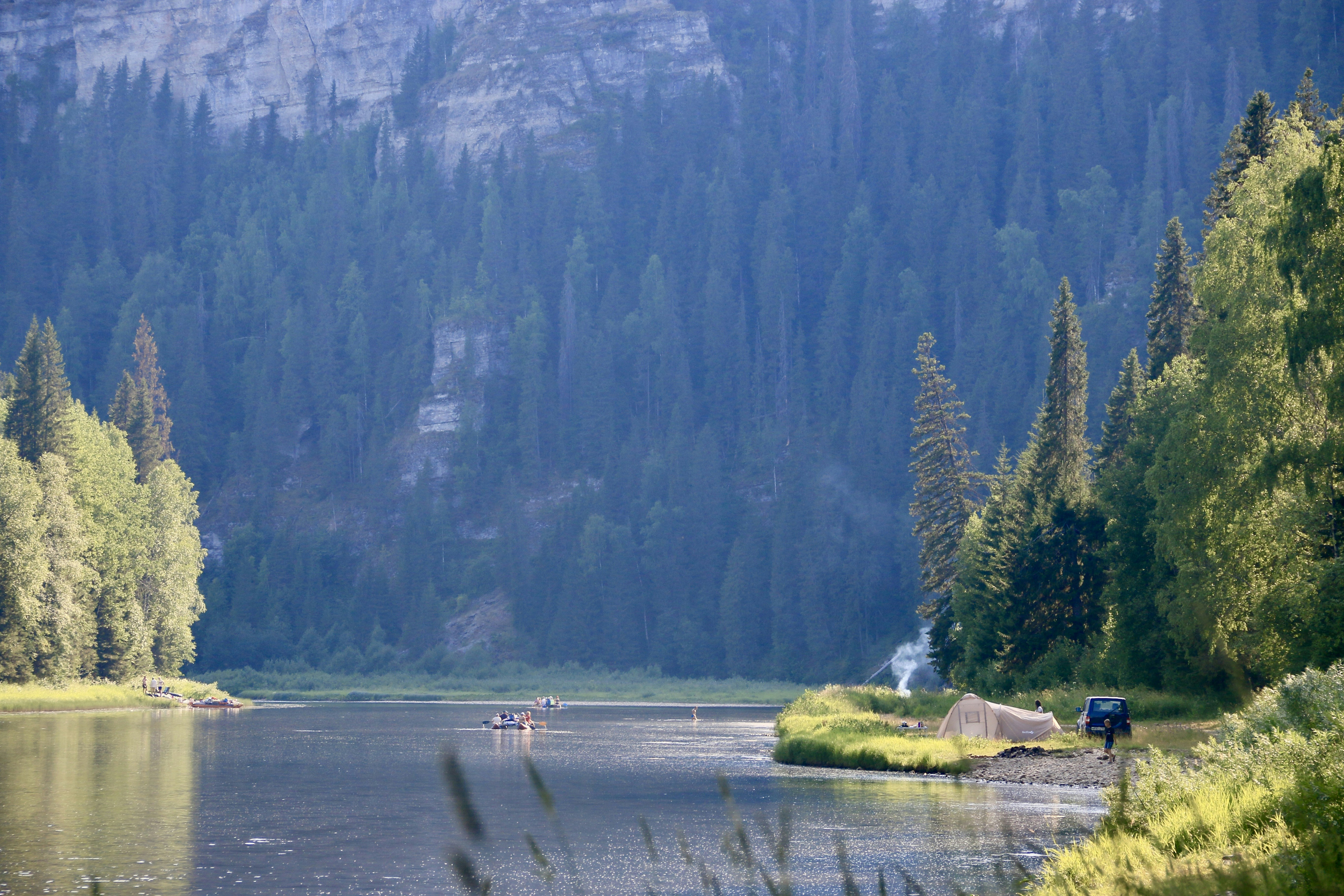 Stop image for Taos Adventure Loop: 3 Days of Family & Nature Escapes - a lake surrounded by trees and a mountain in the background -  in Southwest USA - Photo by Polina Koroleva on Unsplash