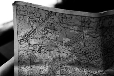 Close-up of a detailed contour map spread out on a table.