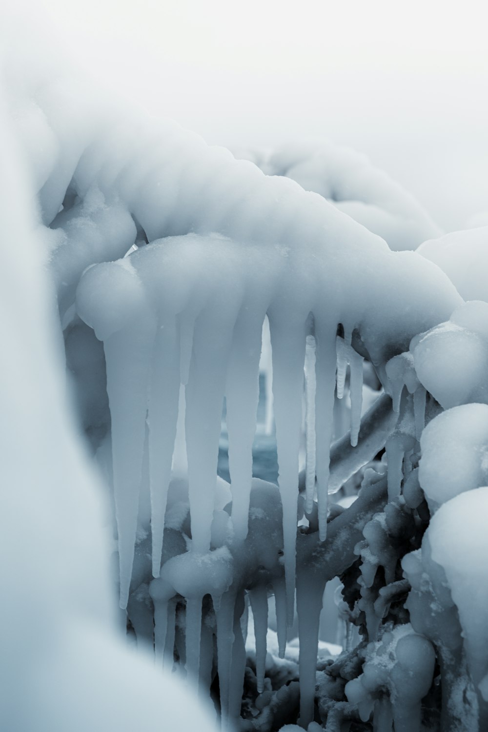 a bunch of ice hanging off the side of a tree