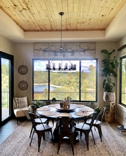 a dining room with a table and chairs