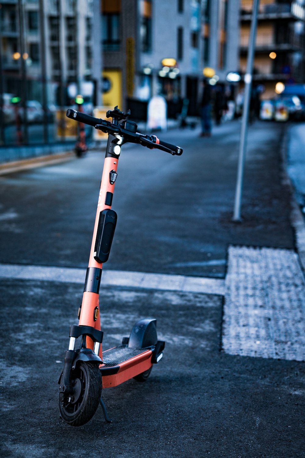 a scooter parked on the side of the road