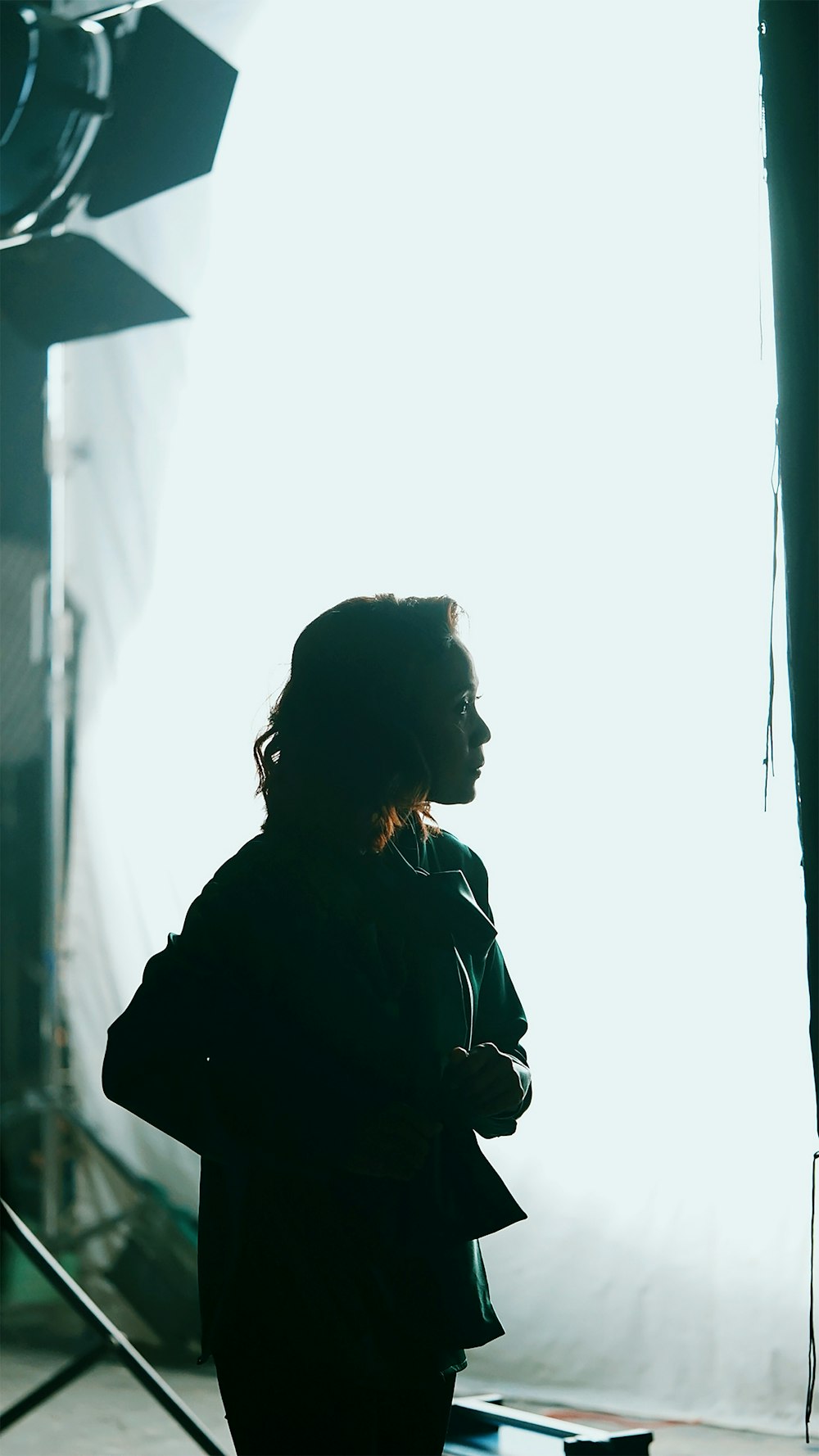 a person standing in front of a light