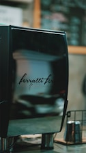 A sleek commercial coffee machine in a modern café setting.