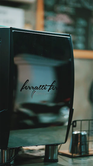 Close-up of a sleek ACF machine with modern design on a clean white background