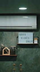 a couple of shelves that have a sign on them