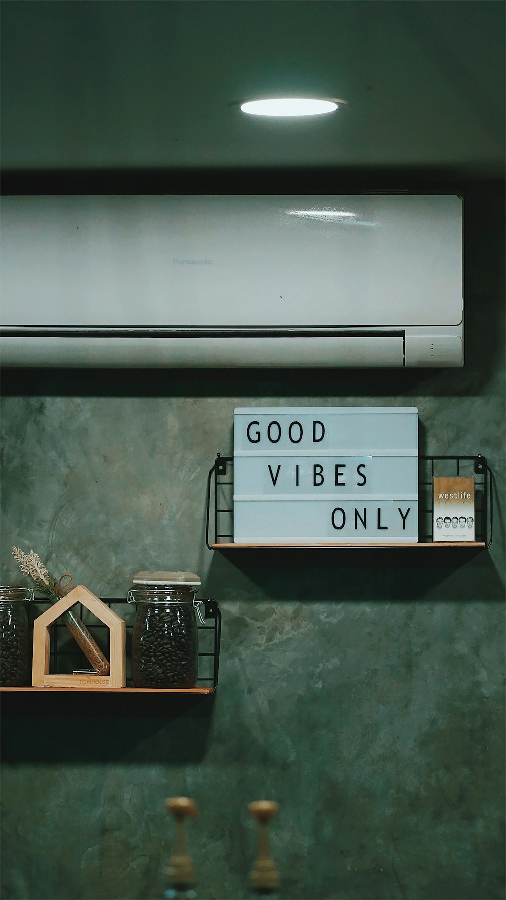 a couple of shelves that have a sign on them