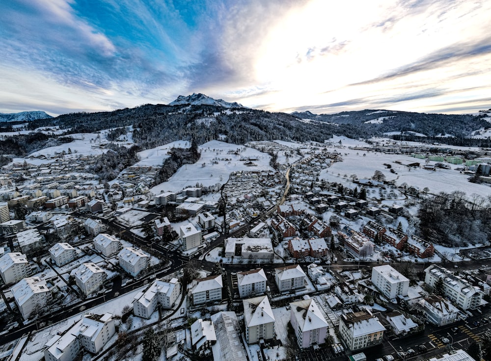 an aerial view of a city in the snow