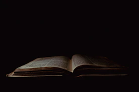 an open book sitting on top of a table