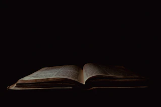 an open book sitting on top of a table