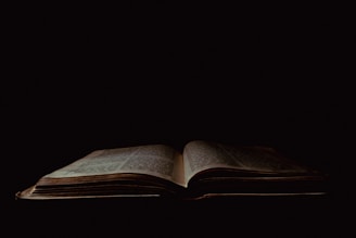 an open book sitting on top of a table