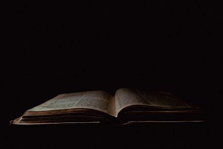 an open book sitting on top of a table