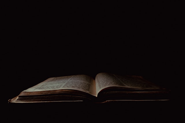 an open book sitting on top of a table