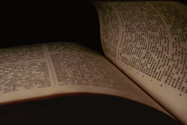 a close up of an open book on a table