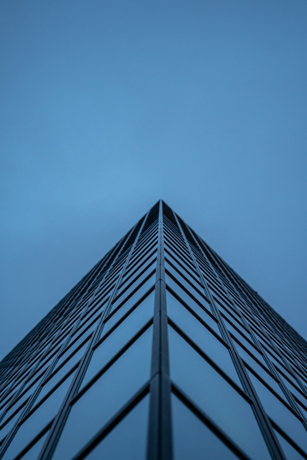 a tall building with a sky background