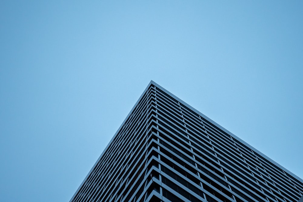 a tall building with a sky background