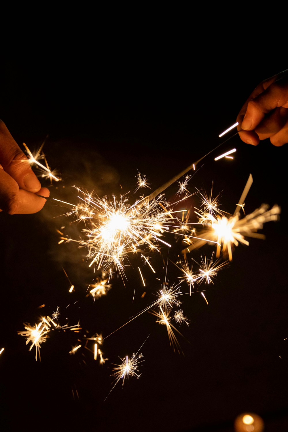 a person holding a sparkler in their hand