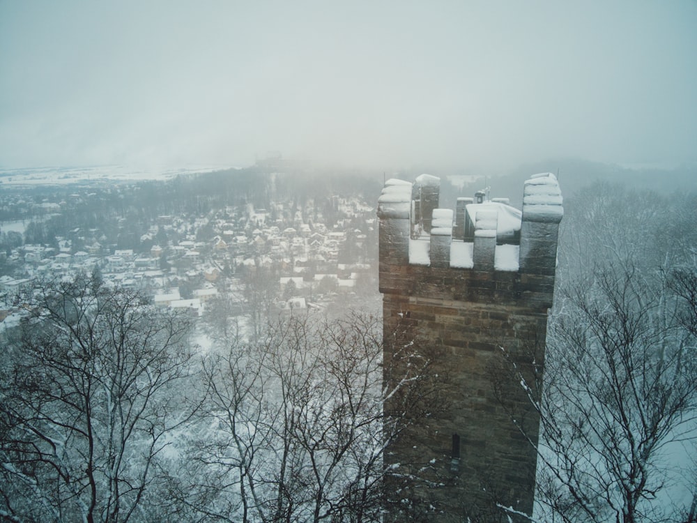 a view of a snowy city from a tower