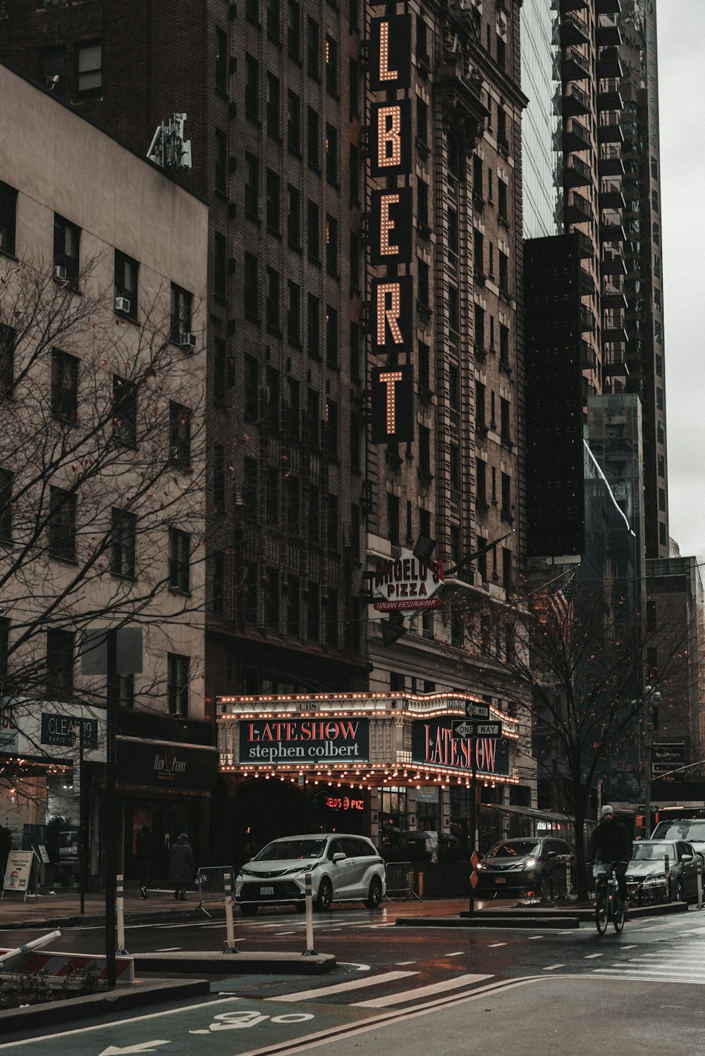 a city street filled with lots of tall buildings