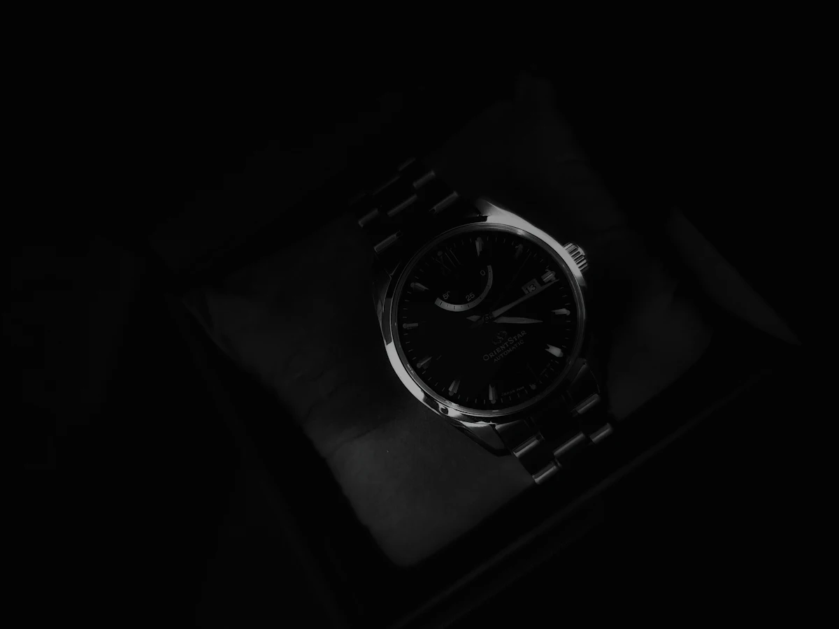 An Orient Star automatic on a table in low light