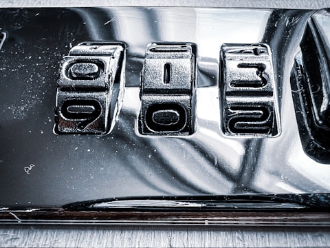 a close up of a metal plate with numbers on it