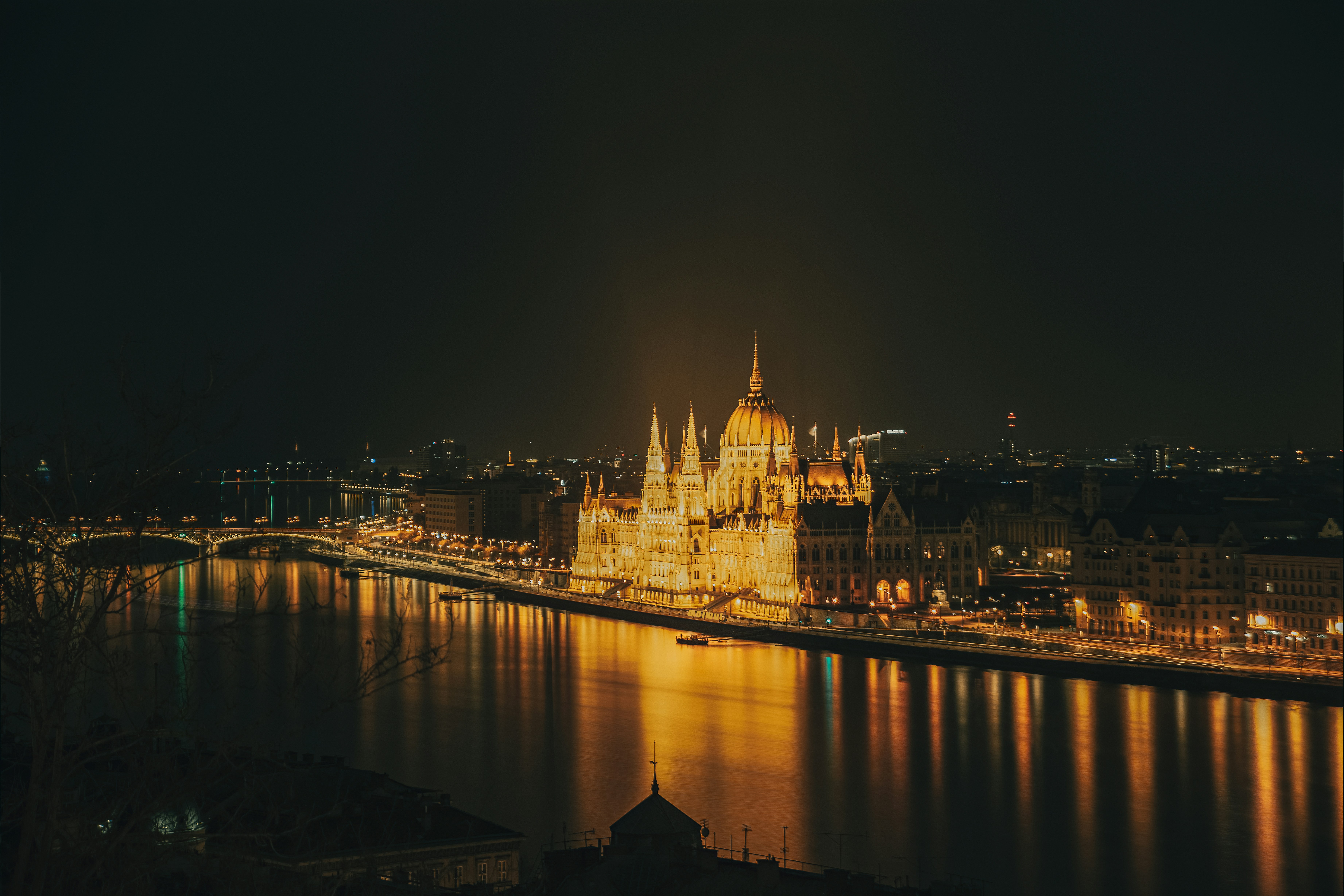 a night view of a city and a bridge
