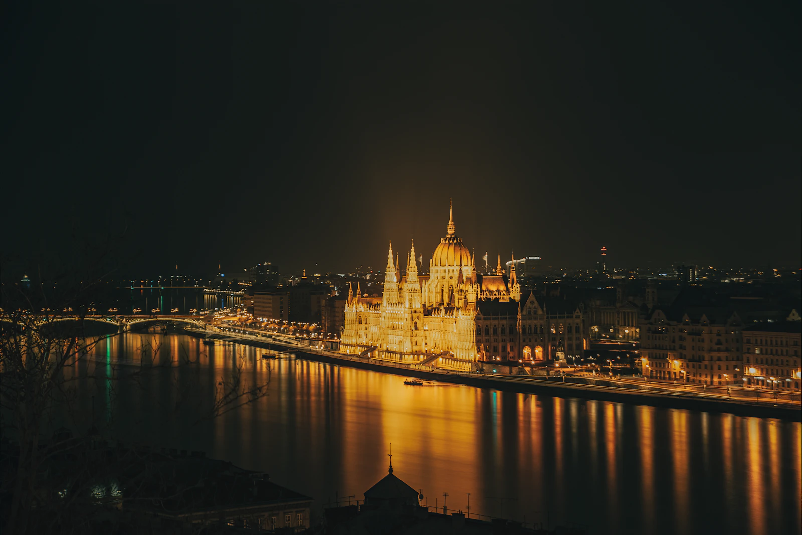 Hungarian Parliament illuminated beside the Danube in Budapest