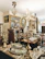 An antique shop interior featuring ornate chandeliers, intricately designed brass and silver items, and elegant wooden furniture. Framed paintings with gold accents are displayed on the walls, and the overall ambiance suggests a vintage, opulent style. The room is filled with a variety of decorative items, including vases and mirrored surfaces, showcasing a rich collection of classic decor.