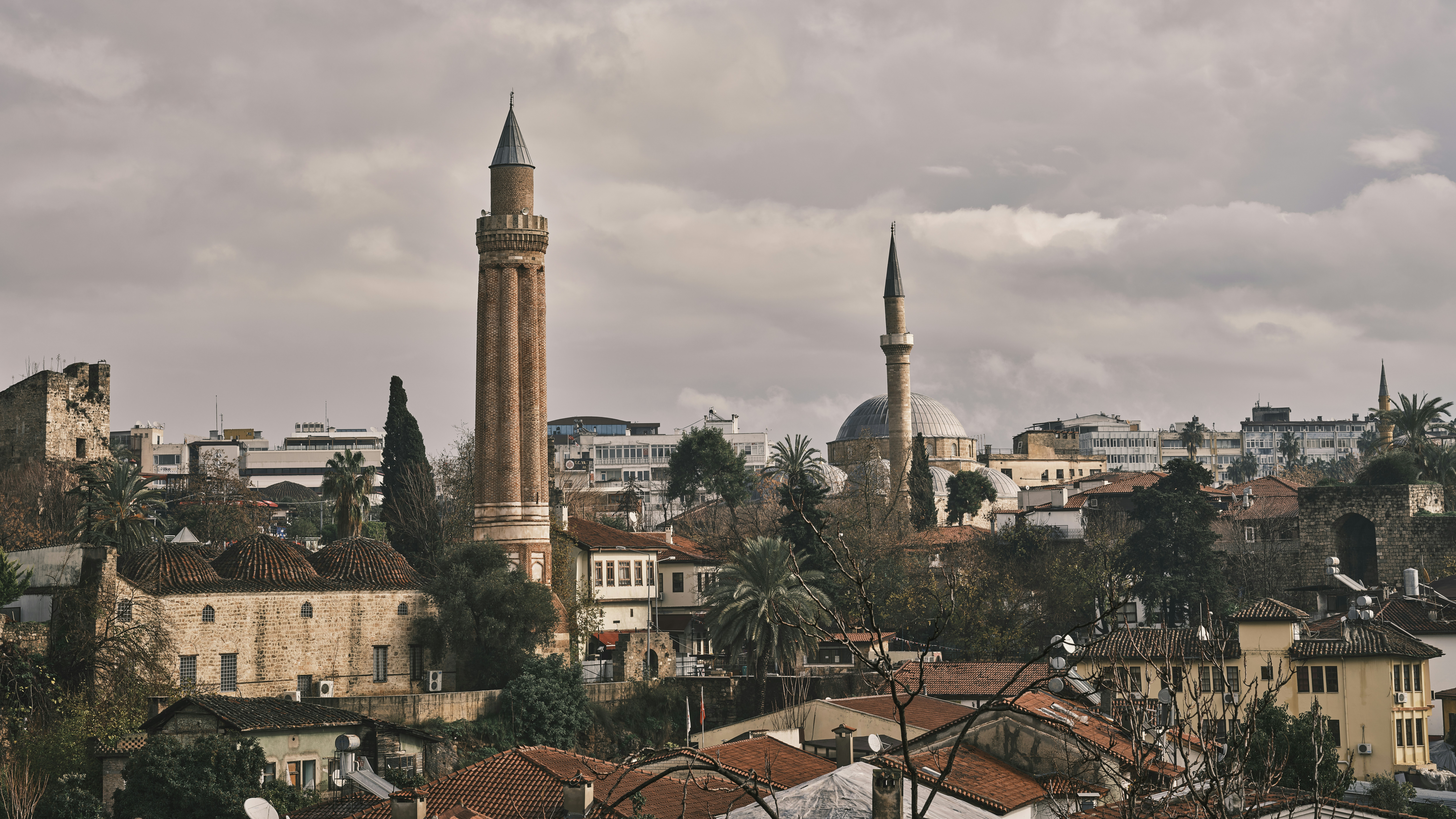 a tall tower with a clock on top of it, Old town city scenery from Antalya, Turkey