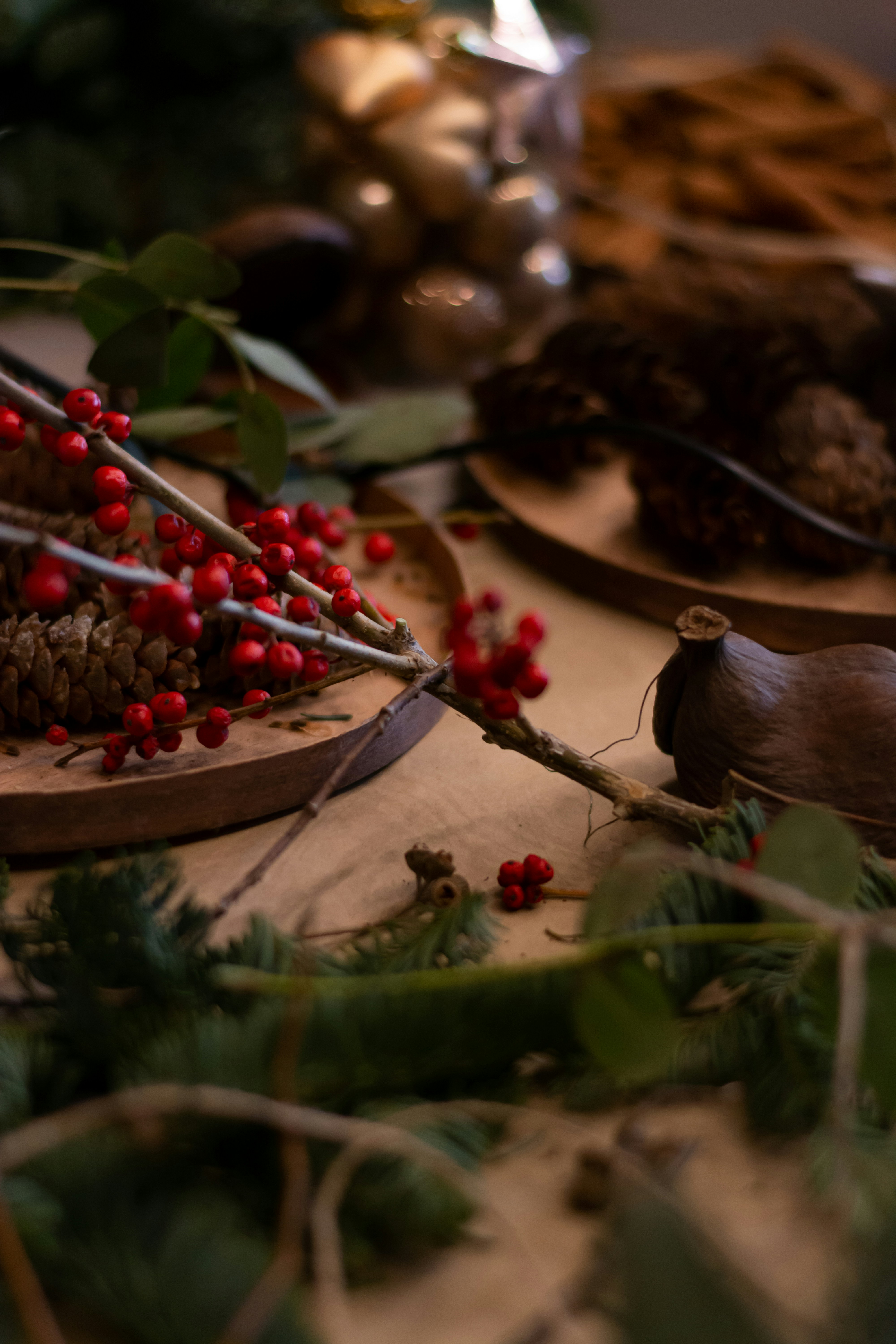 a table topped with plates of food covered in holly