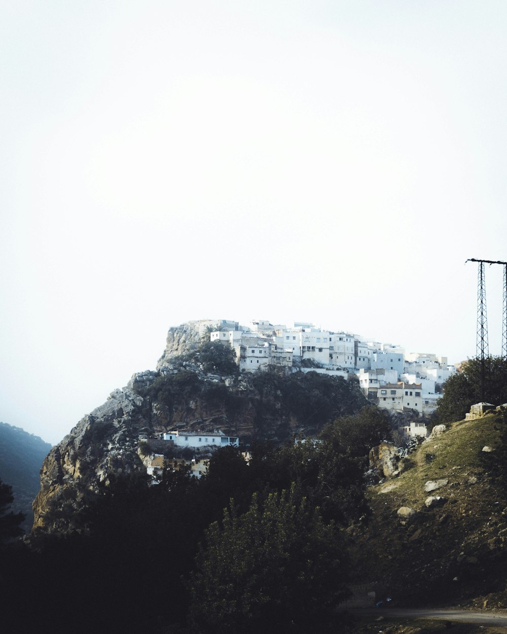 a hill with a bunch of buildings on top of it