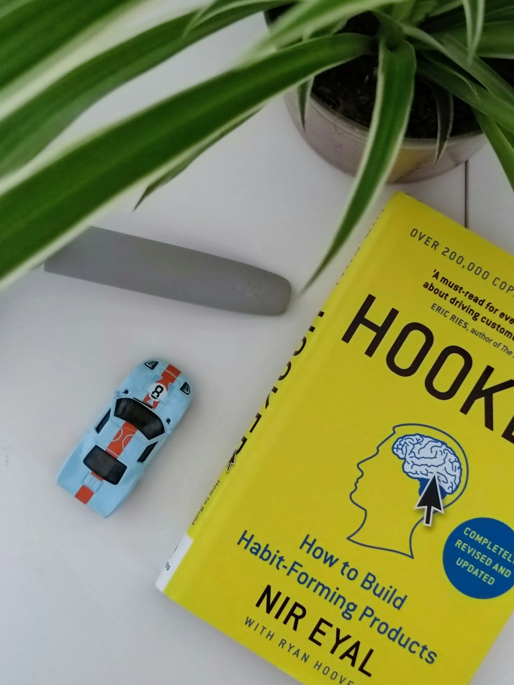 a book sitting on top of a table next to a knife