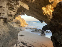 a beach that has some rocks on it
