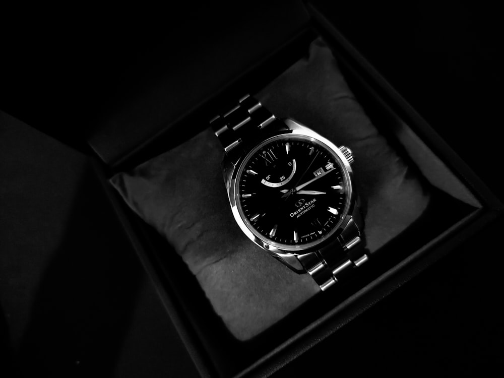 a watch sitting in a box on a table