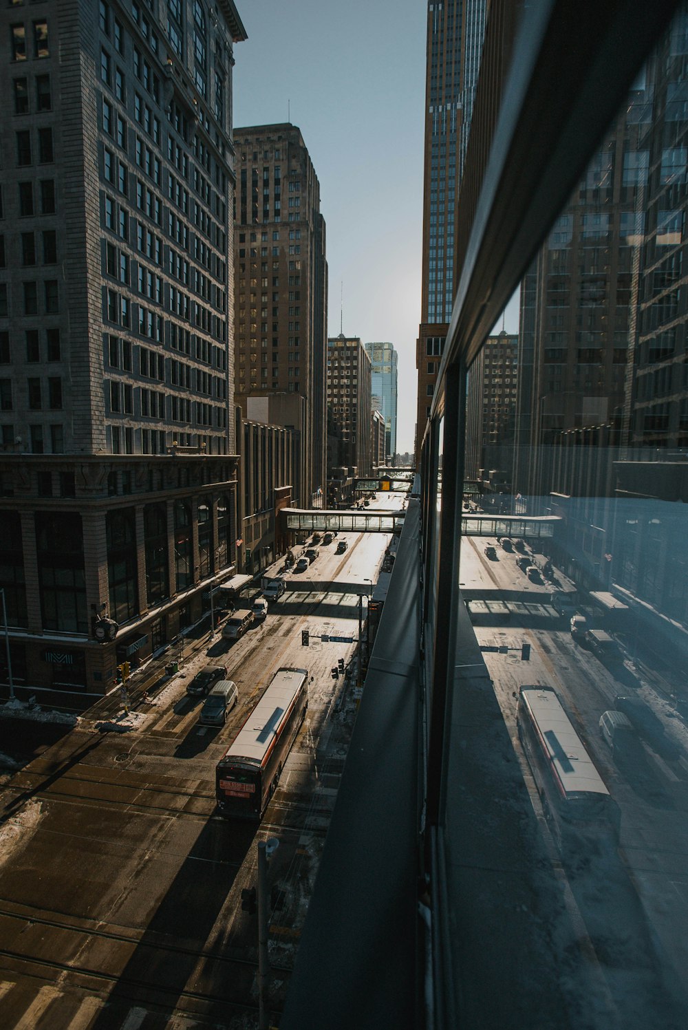 a train traveling through a city next to tall buildings