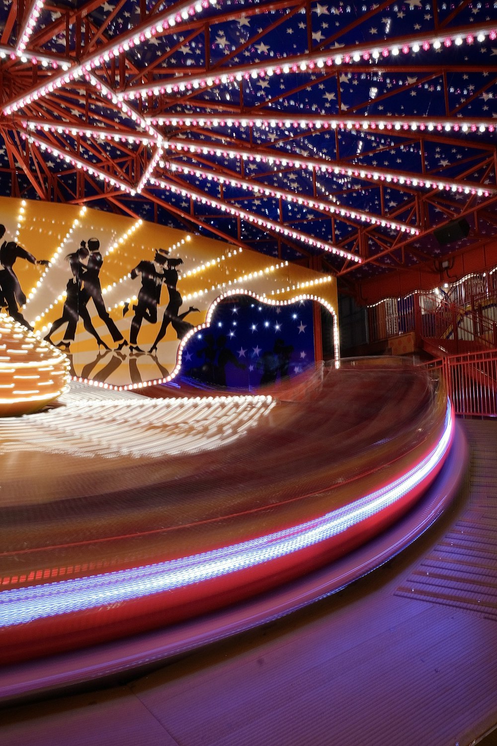 a group of people riding on top of a roller coaster