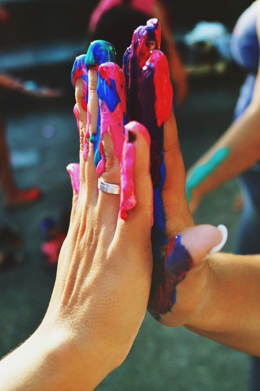 a person holding a small toy in their hands