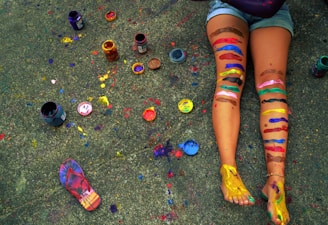 a person with colorful paint on their legs