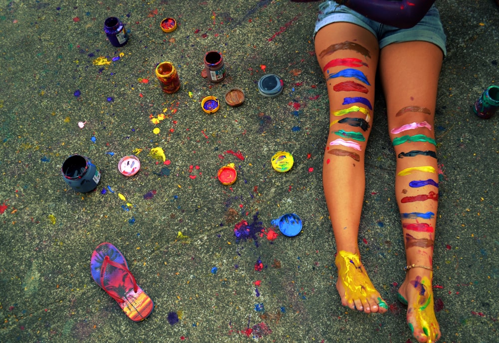 a person with colorful paint on their legs