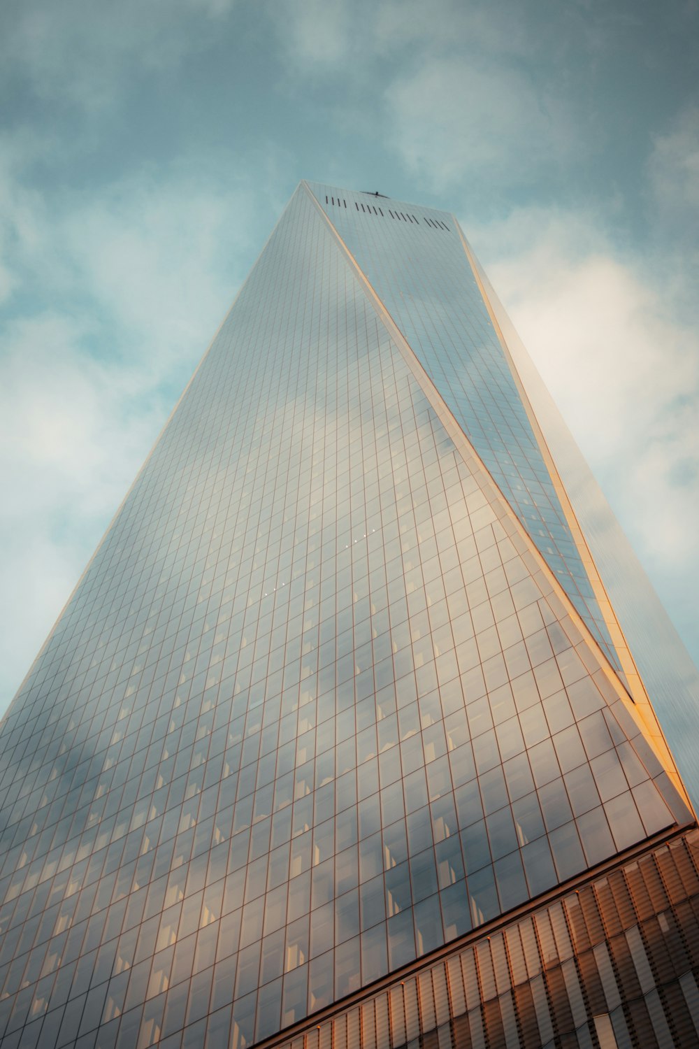 a very tall building with a sky background