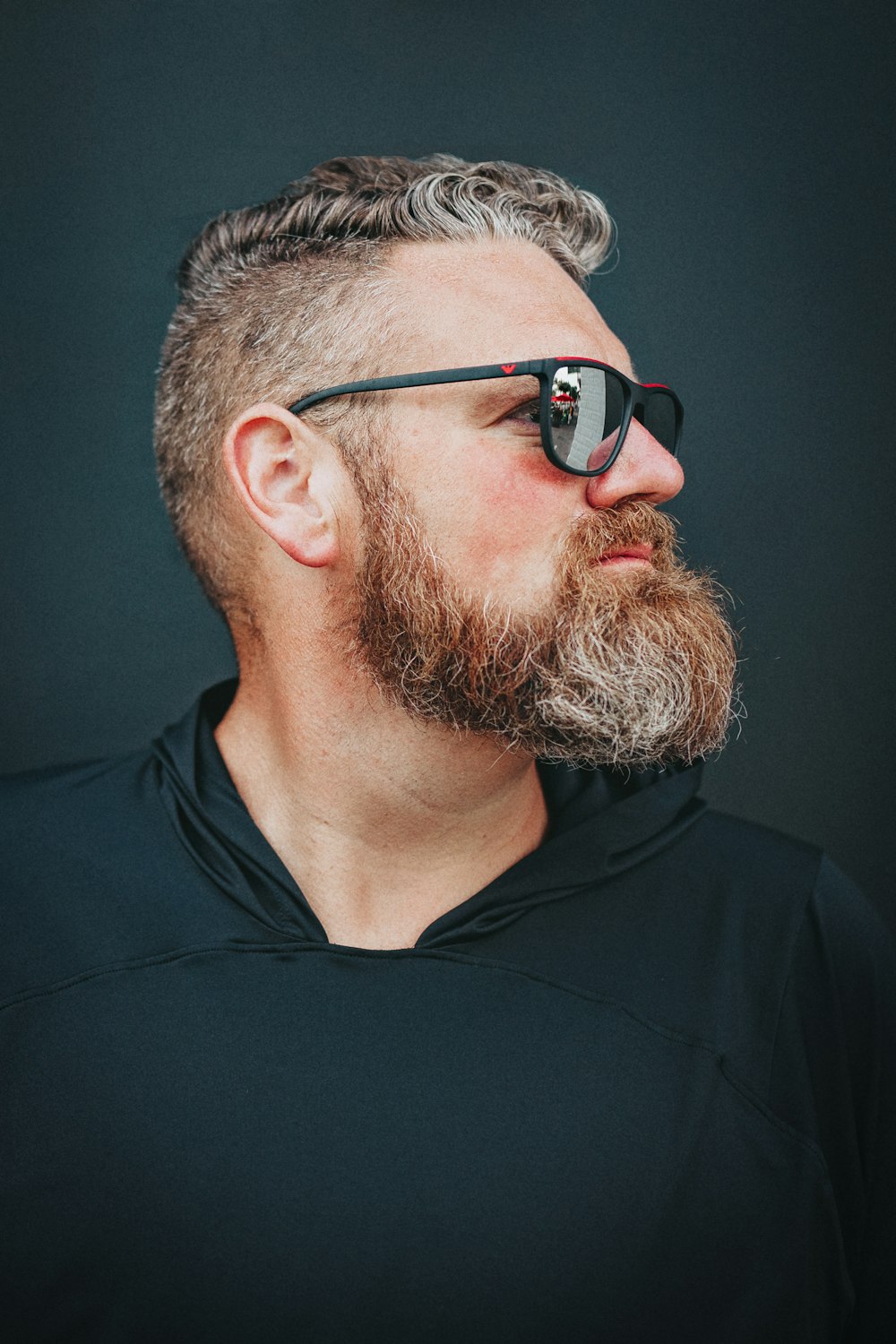 a man with a beard wearing sunglasses