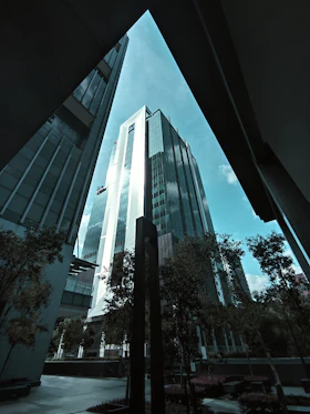 A tall office tower above a city skyline