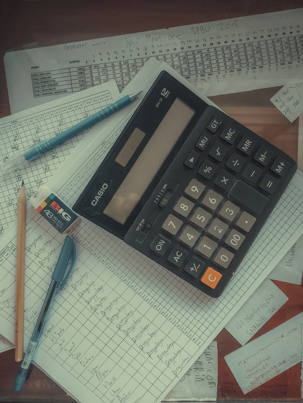 Calculator and paperwork representing entry-level SAP Accounts Payable and Accounts Receivable work