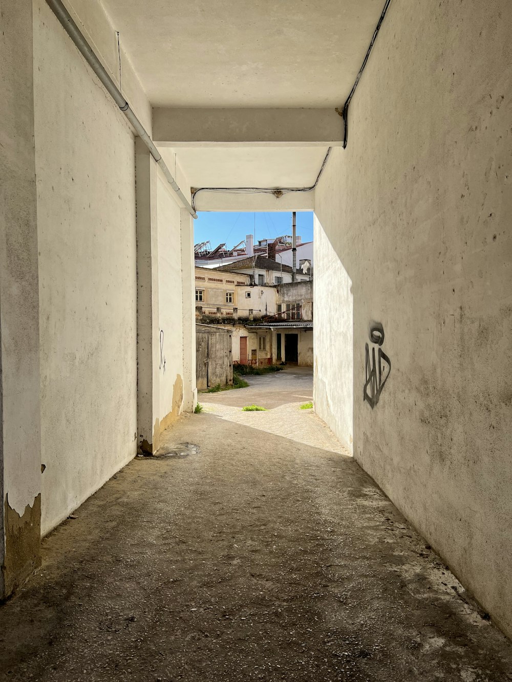 an empty hallway with a sign on the wall