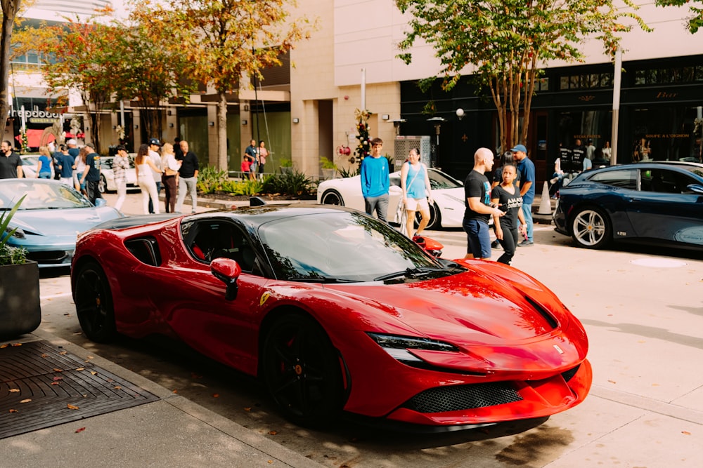 a red sports car parked on the side of the road