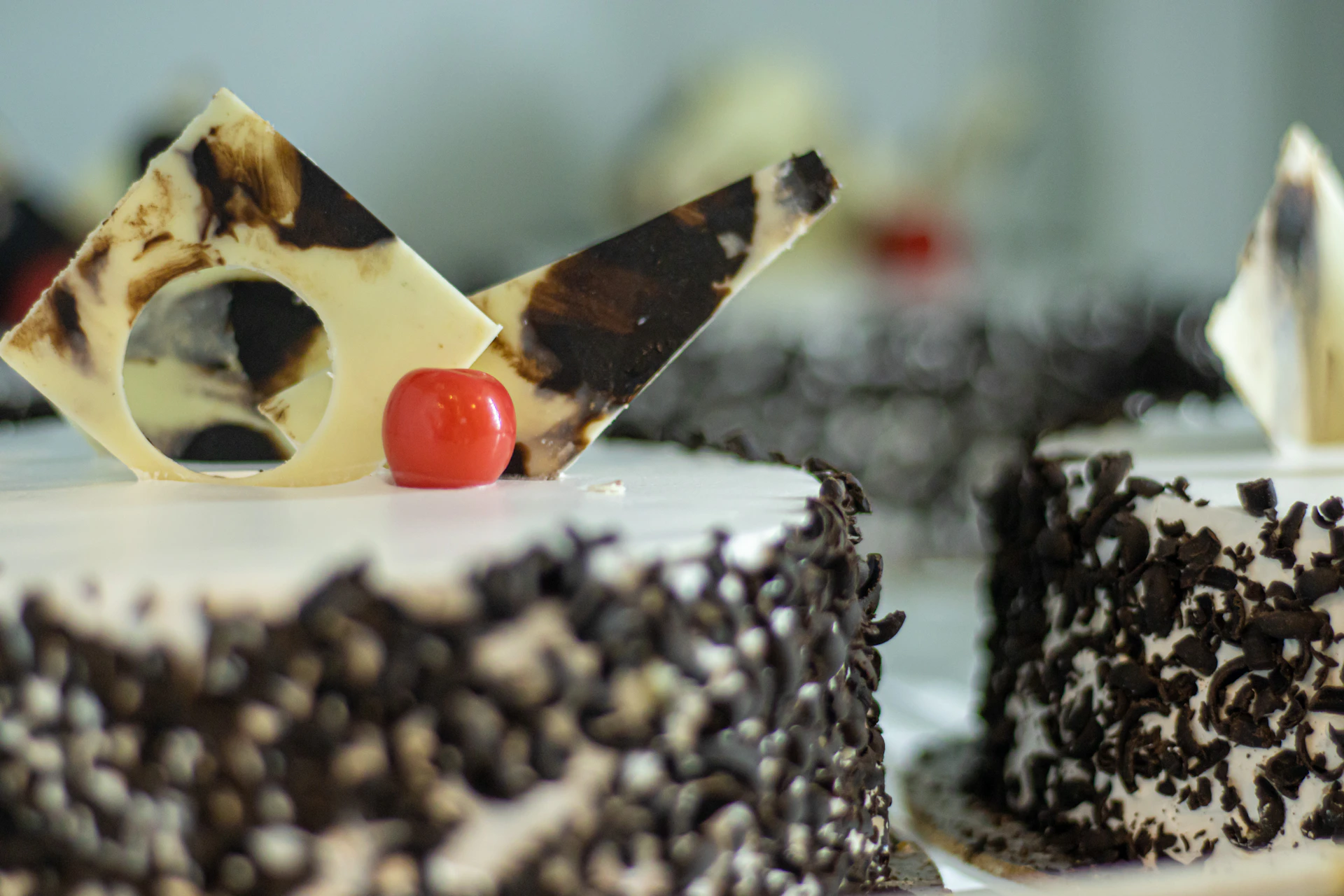 a close up of a cake with a cherry on top
