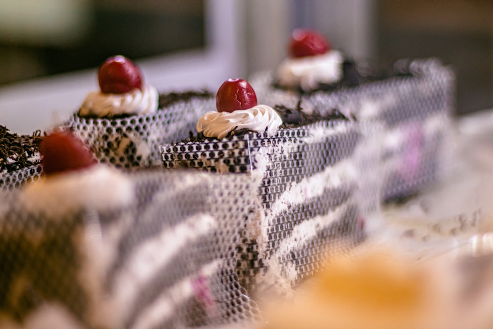 a close up of a bunch of cupcakes on a table