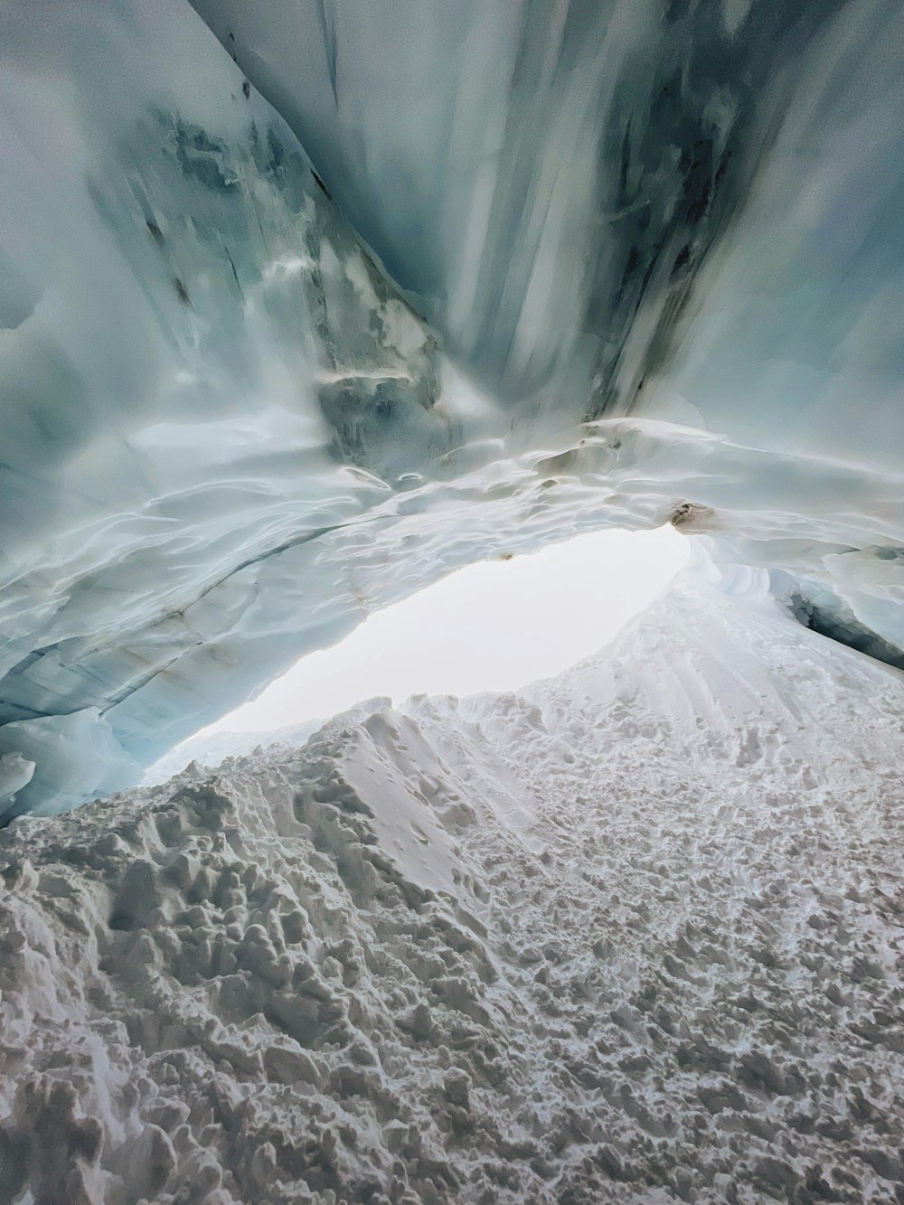 a view of a glacier from inside an ice cave