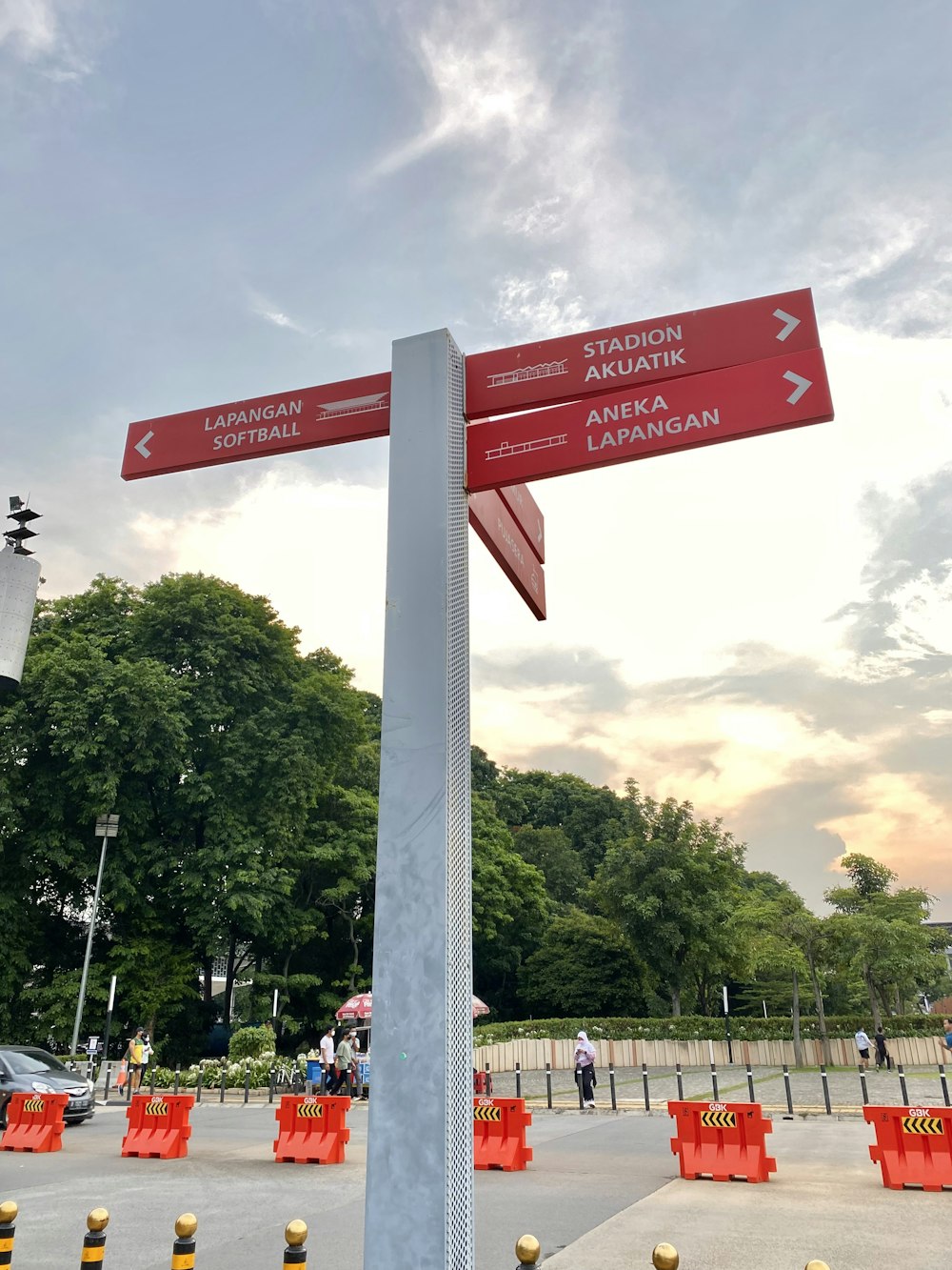 a red street sign sitting on the side of a road